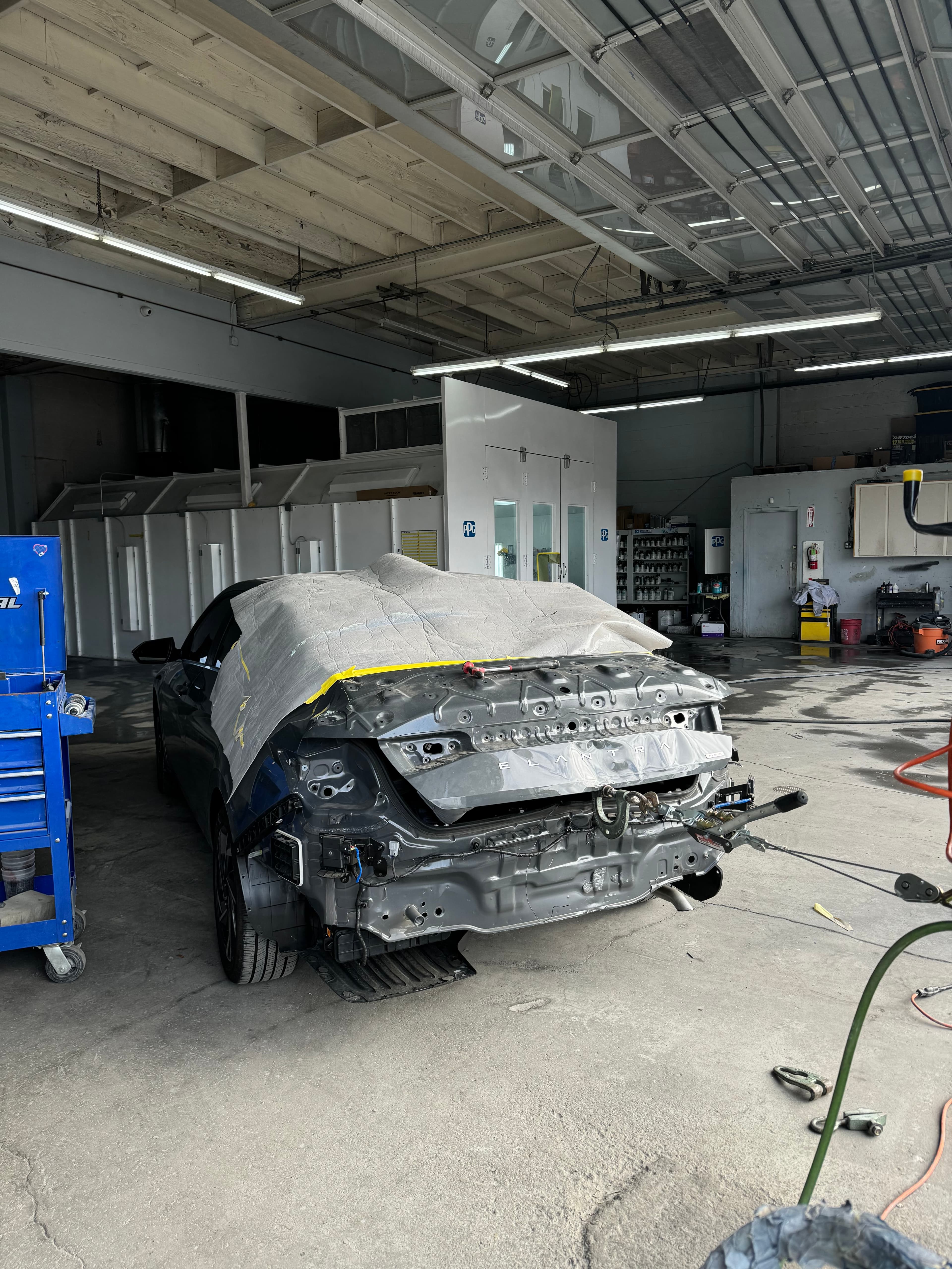 Sedan with front-end collision damage awaiting repair at D&S Auto Repair in Vallejo, CA